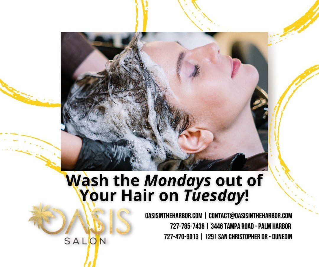 A woman is getting her hair washed at the oasis salon