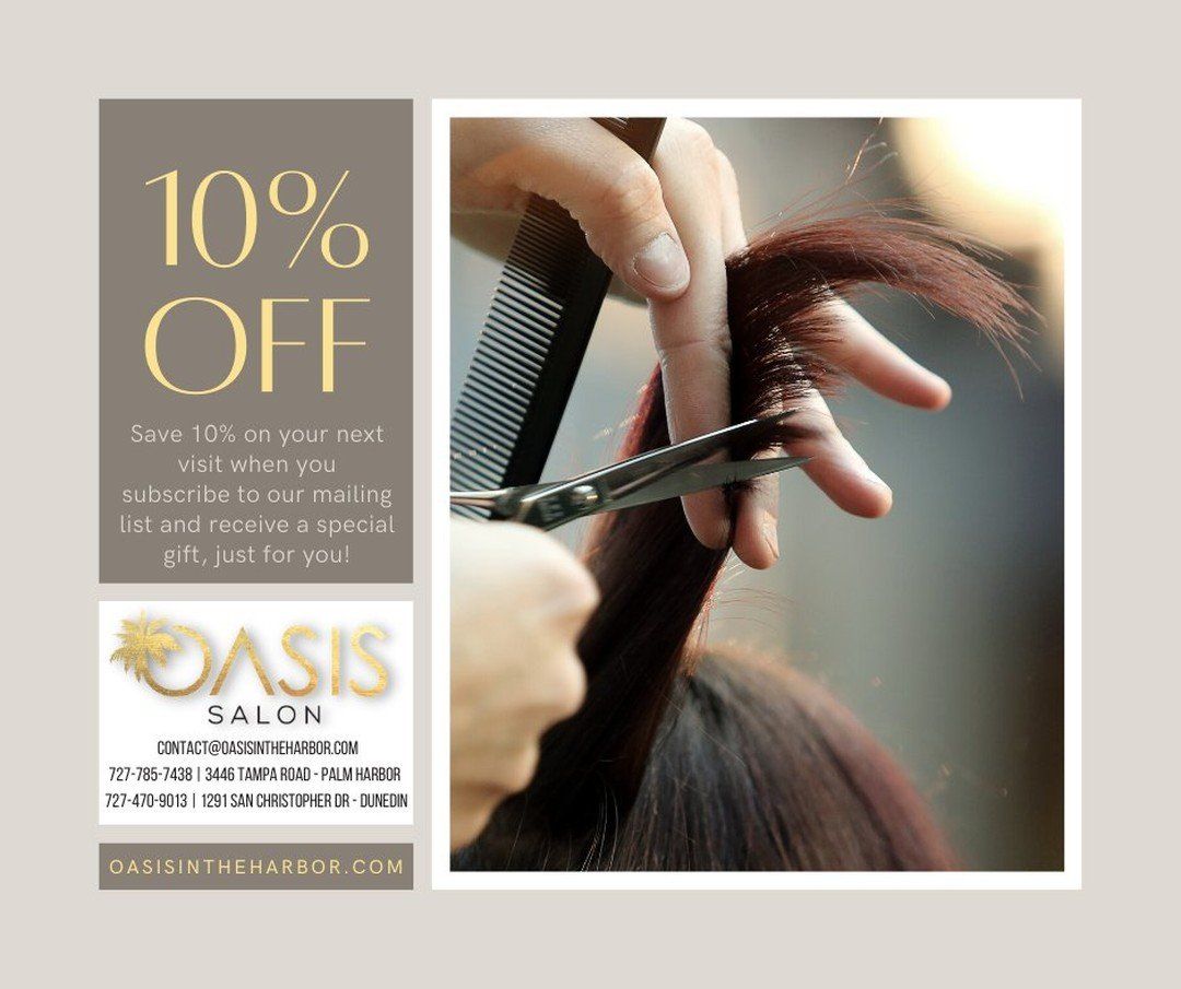 A woman is getting her hair cut at the oasis salon.