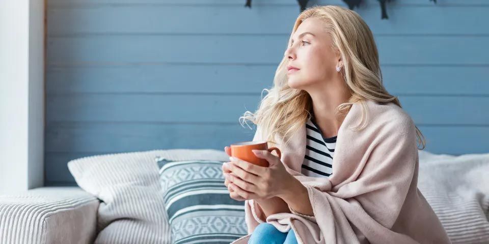 Woman Sitting on Sofa — Vashon, WA — Vashon Heating & Cooling