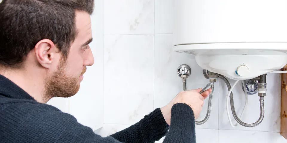 Repairman Repairing Electric Boiler — Vashon, WA — Vashon Heating & Cooling