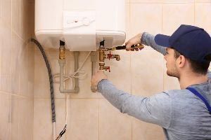 Installing New Water Heater — Vashon, WA — Vashon Heating & Cooling Installing New Water Heater — Vashon, WA — Vashon Heating & Cooling