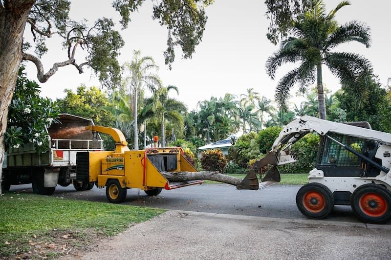 A Bobcat Pulls a Tree Chipper in Action at Tree Change Nq — Tree Change NQ in Townsville, QLD