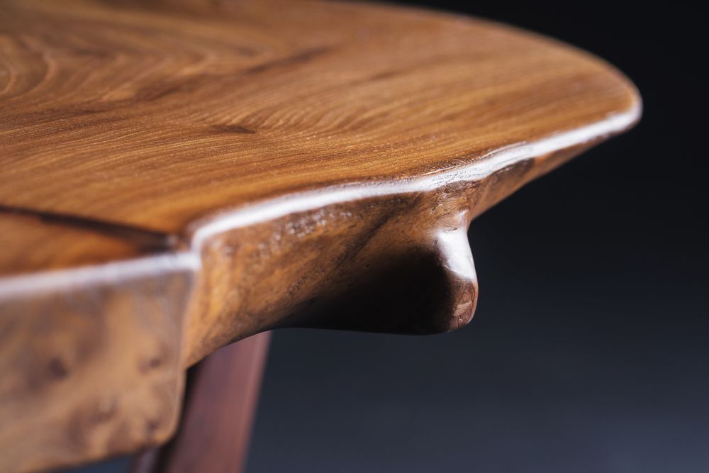 A Close Up Of A Wooden Table With A Black Background — Tree Change NQ in Magnetic Island, QLD