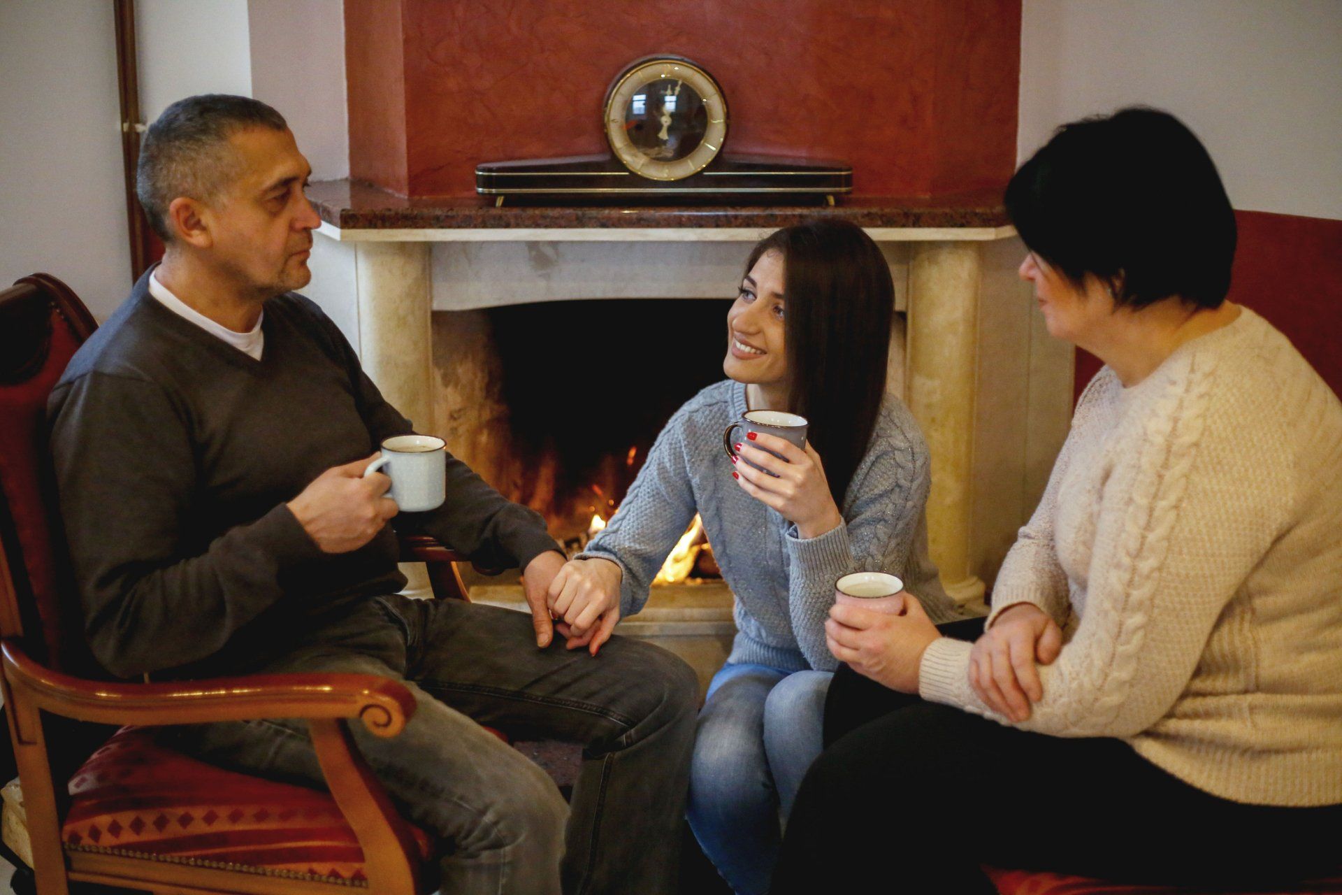 Family Near Fireplace — Clark, NJ — Palumbo Fuel T/A L&B Heating Oil