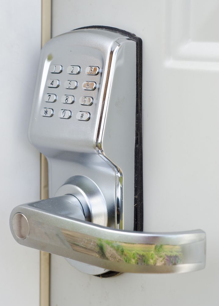 Chrome Keypad Deadbolt Door Lock on A White Door — Terrace Locksmiths in Mayfield, NSW