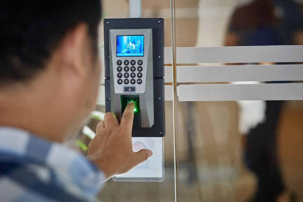 Person Scanning a Green Fingerprint on A Biometric Door Access Keypad — Terrace Locksmiths in Raymond Terrace, NSW