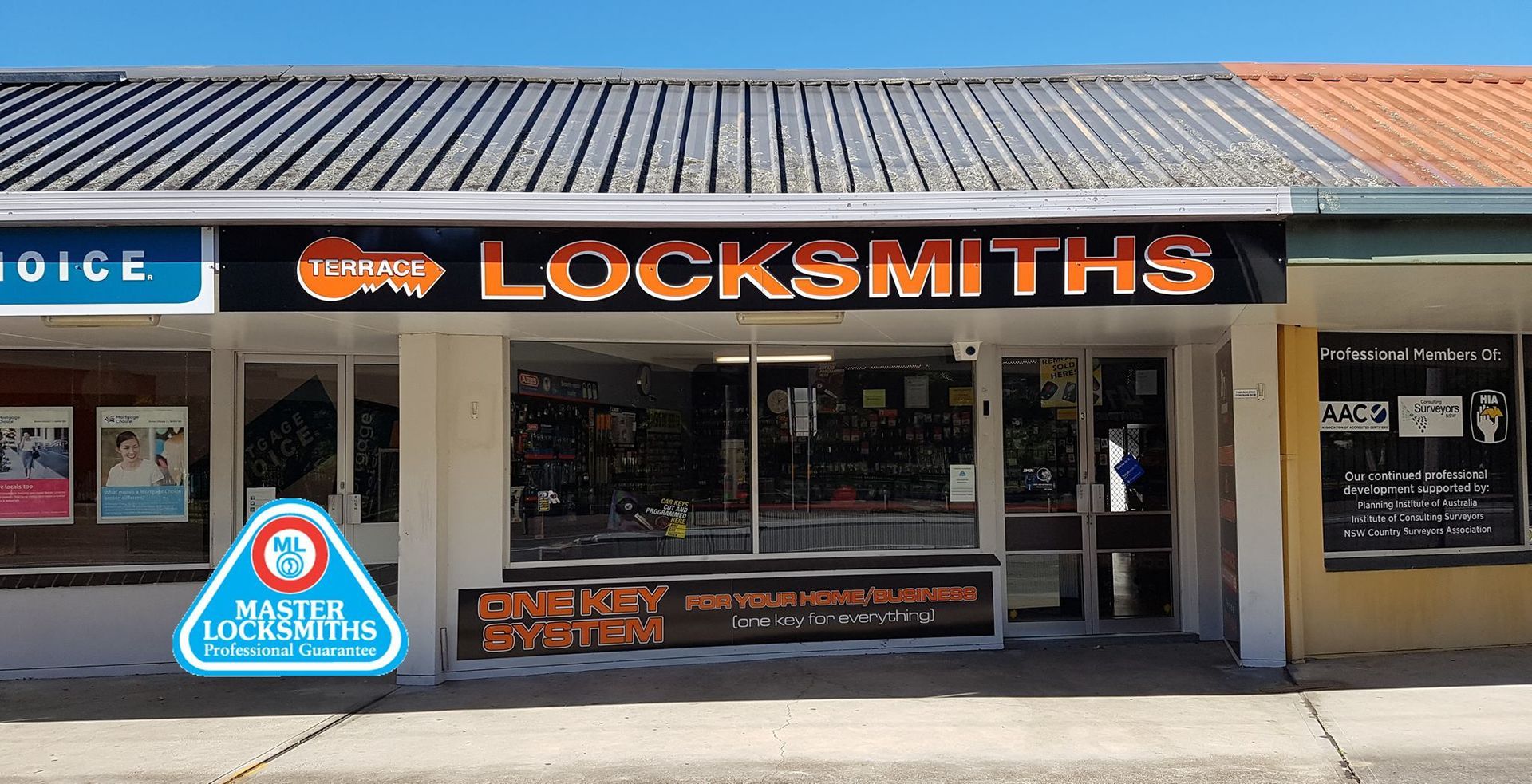 Storefront for A Locksmith Business with Orange Sign — Terrace Locksmiths in Raymond Terrace, NSW