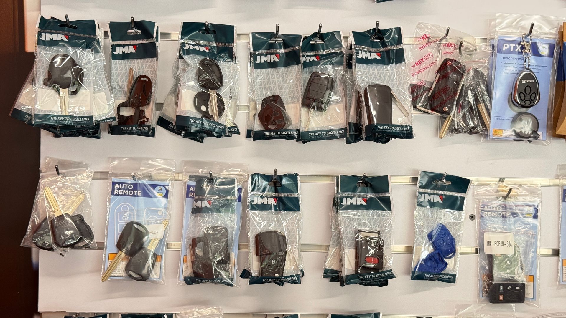 Assorted packaged pet leashes and collars displayed in rows on a store wall — Terrace Locksmiths in Raymond Terrace, NSW