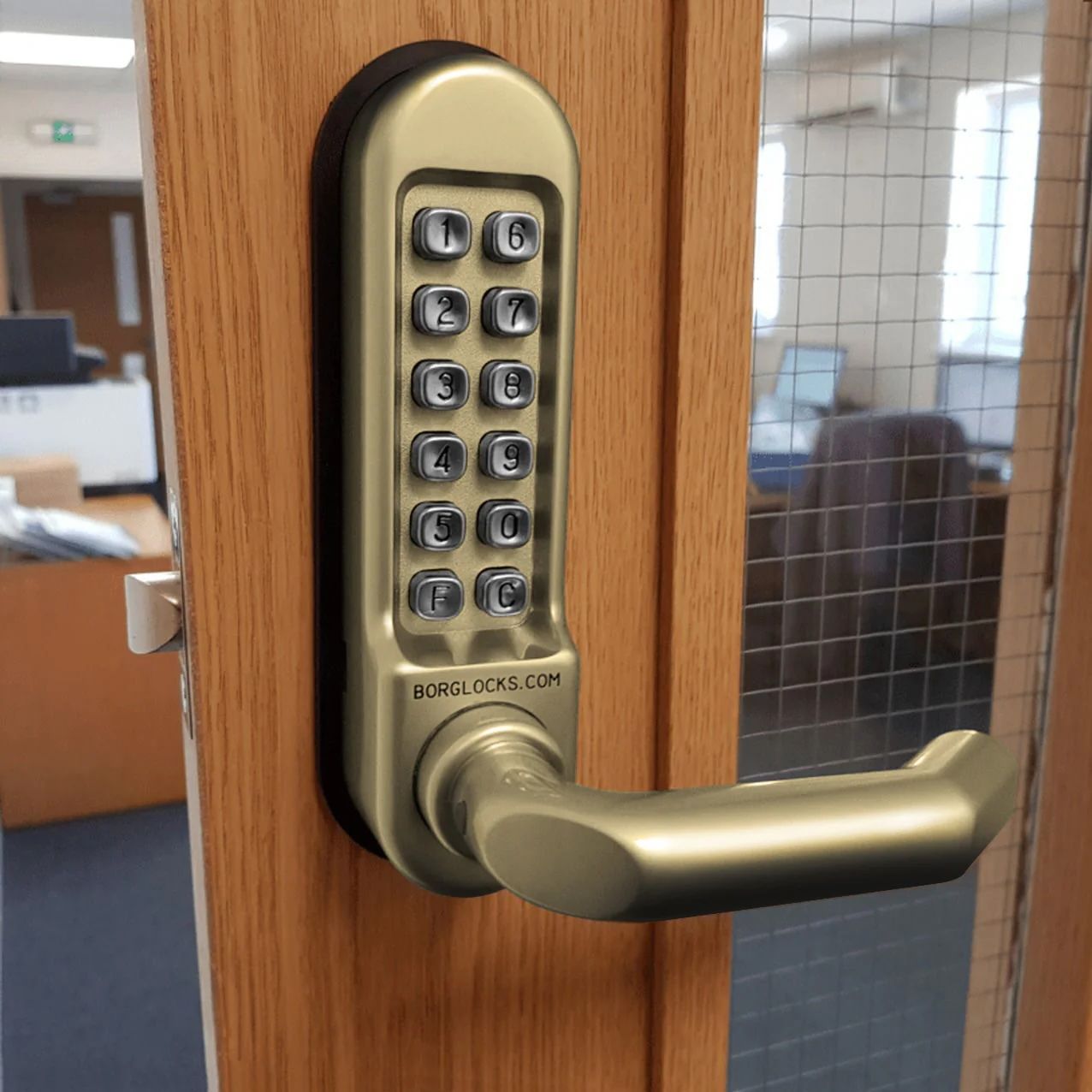 Brass keypad door lock on a wooden office door with a silver handle — Terrace Locksmiths in Raymond Terrace, NSW