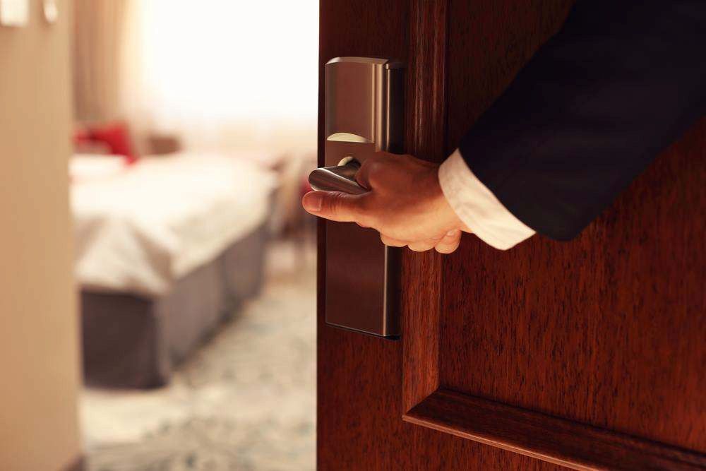 Hand Opening a Hotel Room Door — Terrace Locksmiths in Raymond Terrace, NSW