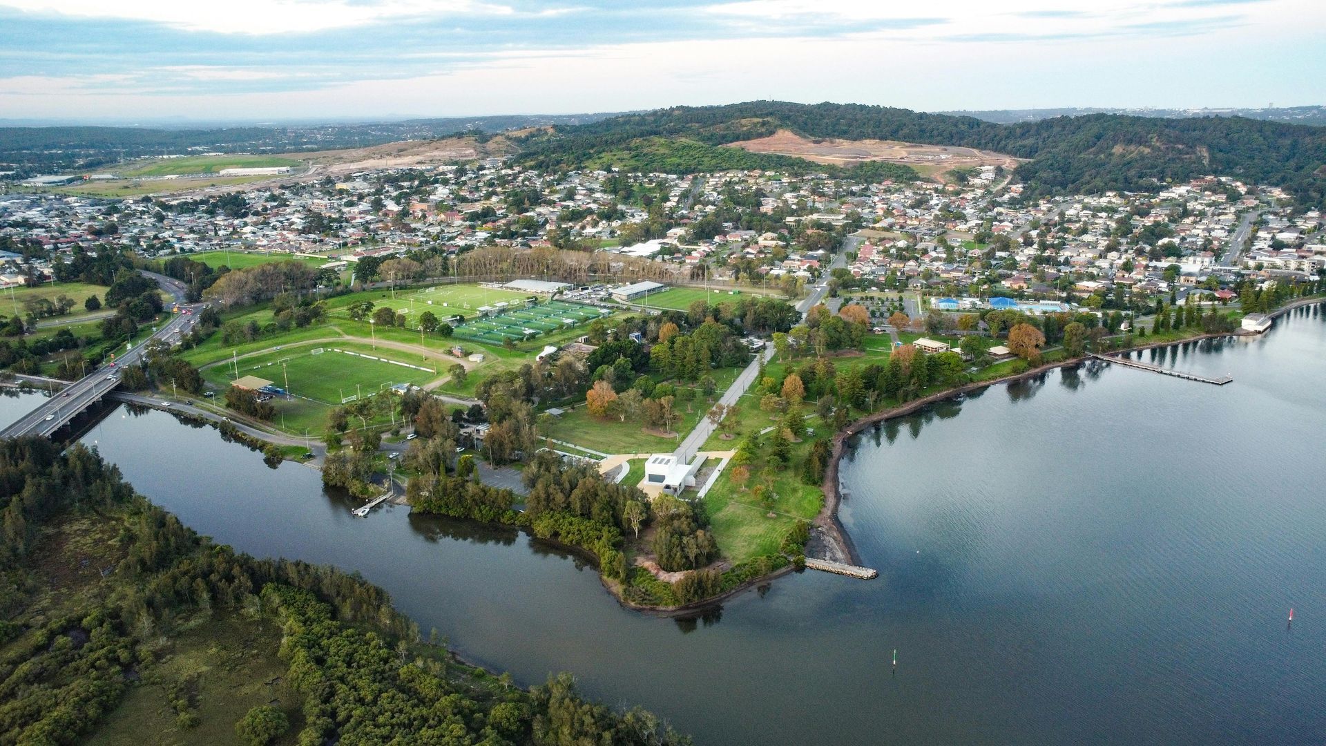 Aerial View of A Lakeside Town with Green Fields, Houses — Terrace Locksmiths in Lake Macquarie, NSW