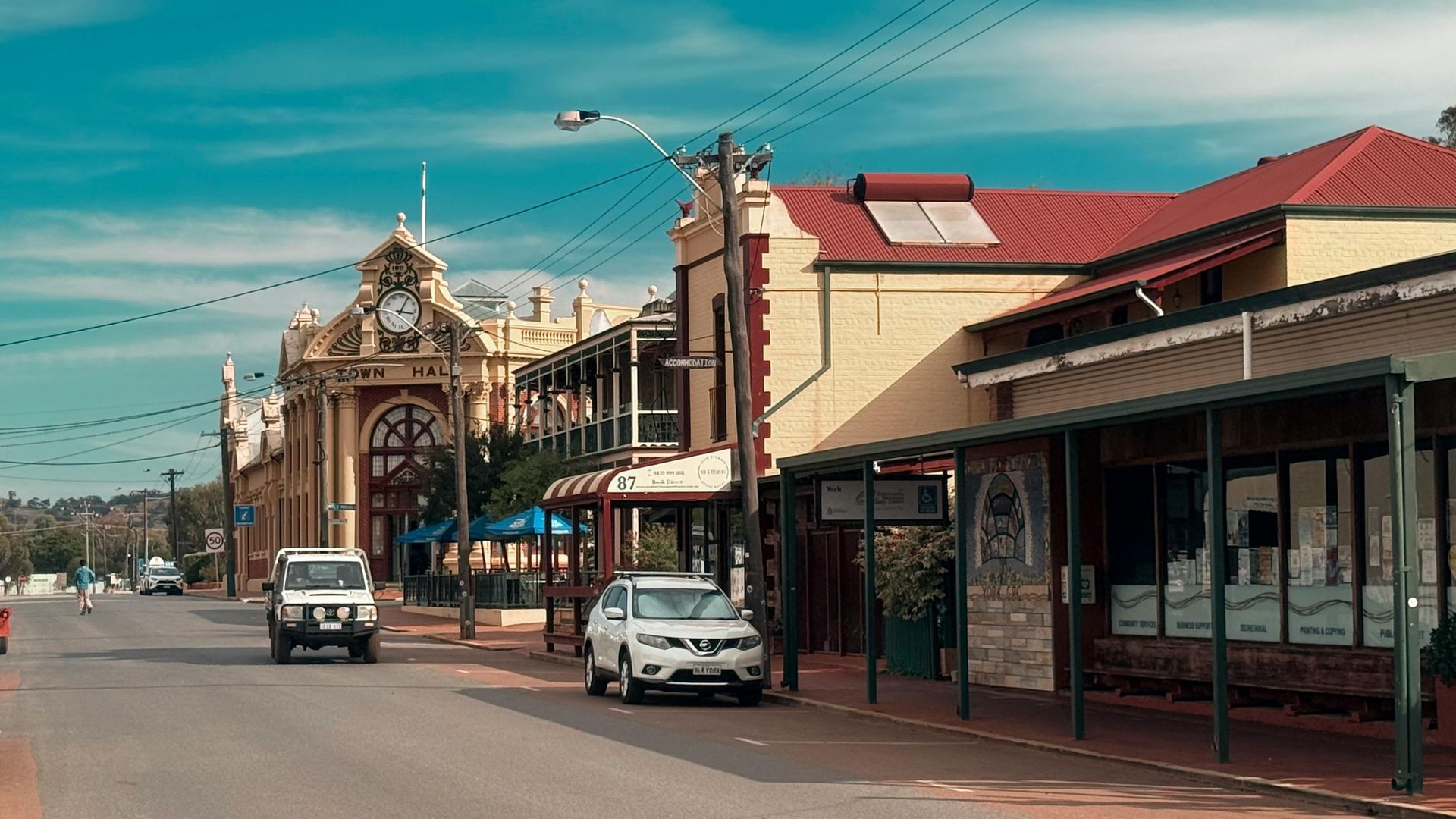 Historic Street with Ornate Church, Parked Cars, and Red-Roofed Shops — Terrace Locksmiths in Cessnock, NSW