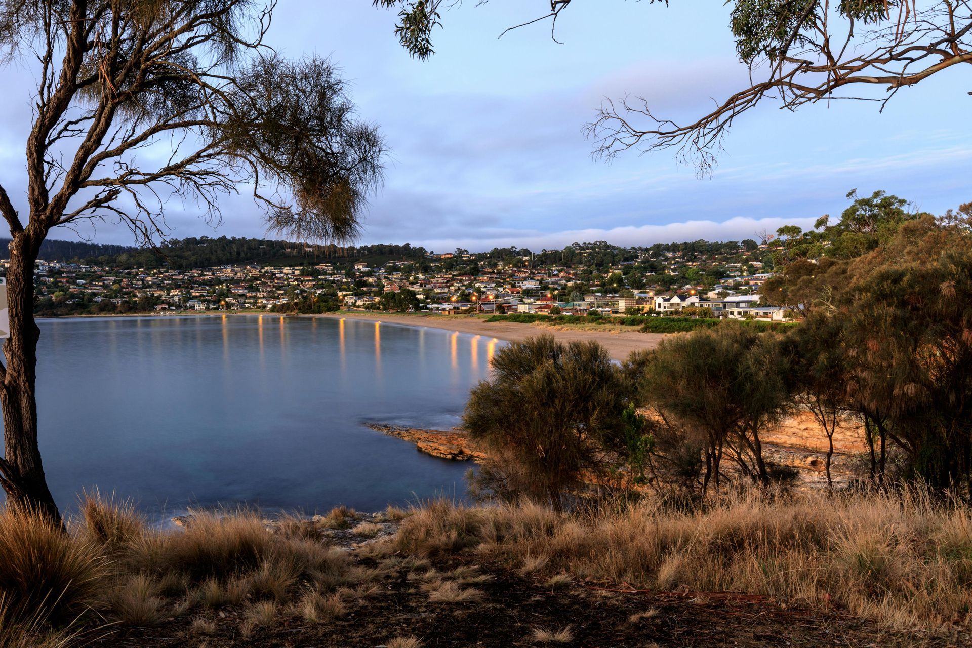 Lake at Dusk with Calm Water, Trees in The Foreground — Terrace Locksmiths in Nelson Bay, NSW