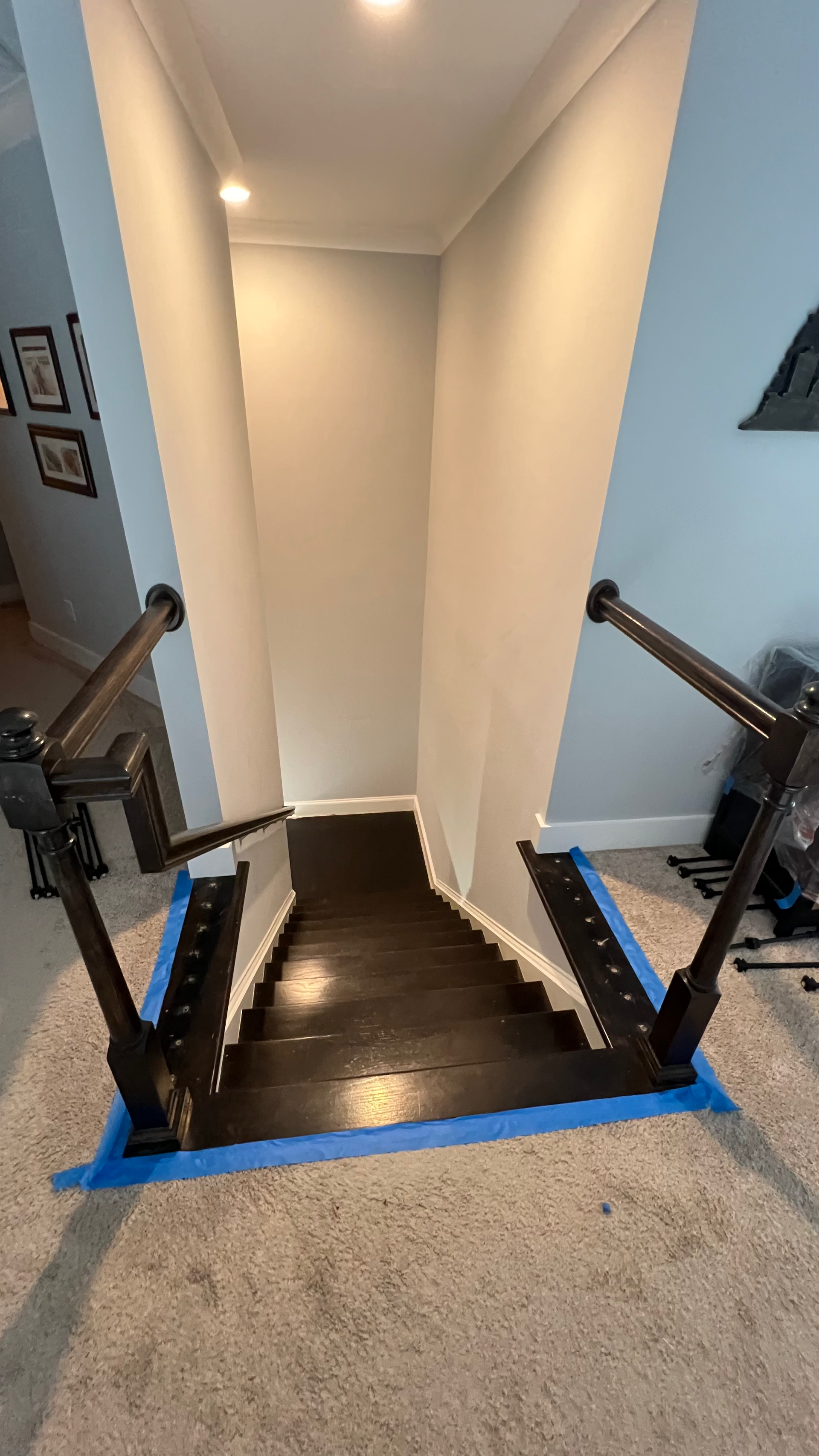 A set of stairs sitting on top of a carpet in a room.