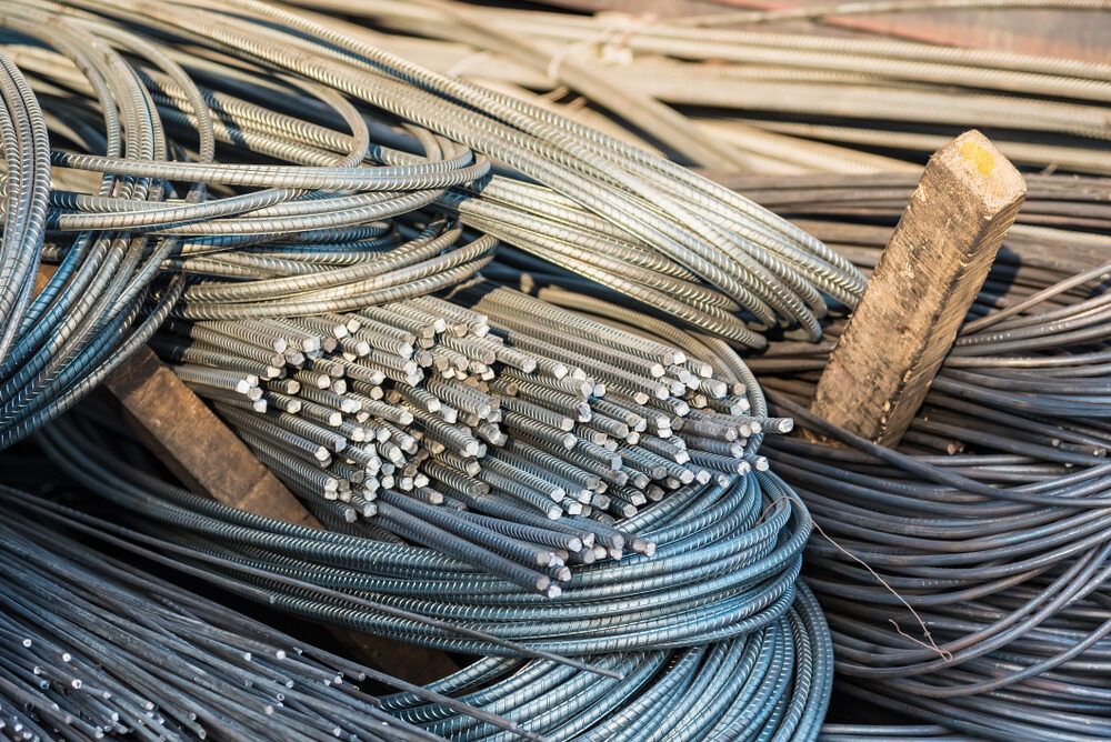 A Bunch of Steel Bars Are Stacked on Top of Each Other on a Table — Top End Steel Supplies Darwin In Pinelands, NT