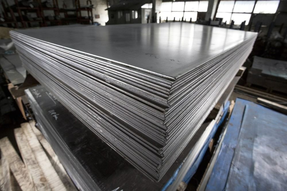 A Stack of Metal Sheets Sitting on Top of Each Other — Top End Steel Supplies Darwin In Pinelands, NT