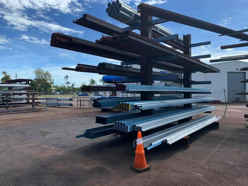 A Bunch of Metal Pieces Are Stacked on Top of Each Other on a Rack — Top End Steel Supplies Darwin In NT