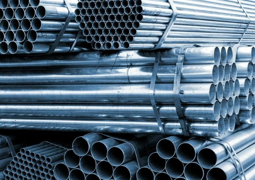 A Bunch of Metal Pipes Are Stacked on Top of Each Other — Top End Steel Supplies Darwin In Tiwi, NT