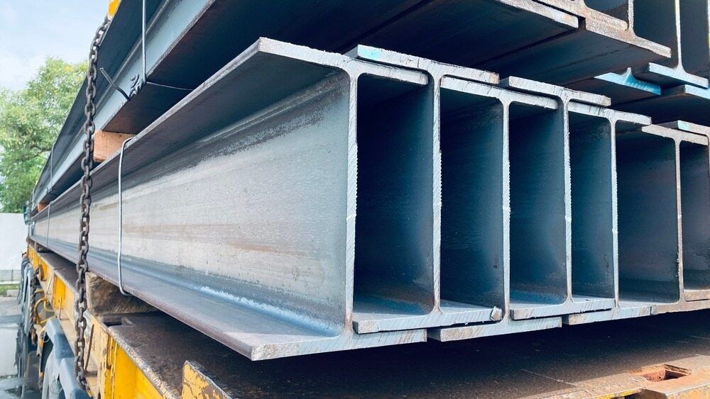 A Stack of Steel Beams Sitting on Top of Each Other on a Truck — Top End Steel Supplies Darwin In Tiwi, NT