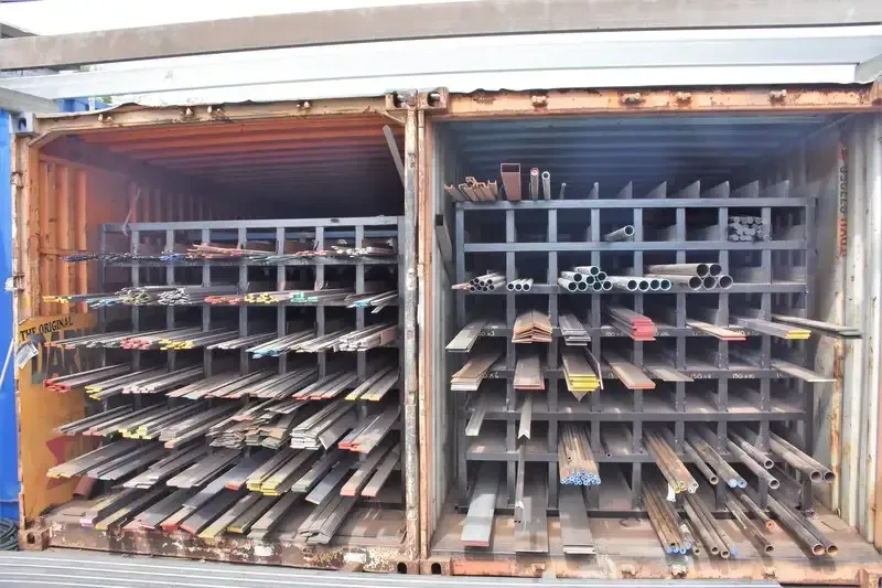 A Container Filled With Lots of Metal Bars and Tubes — Top End Steel Supplies Darwin In Pinelands, NT