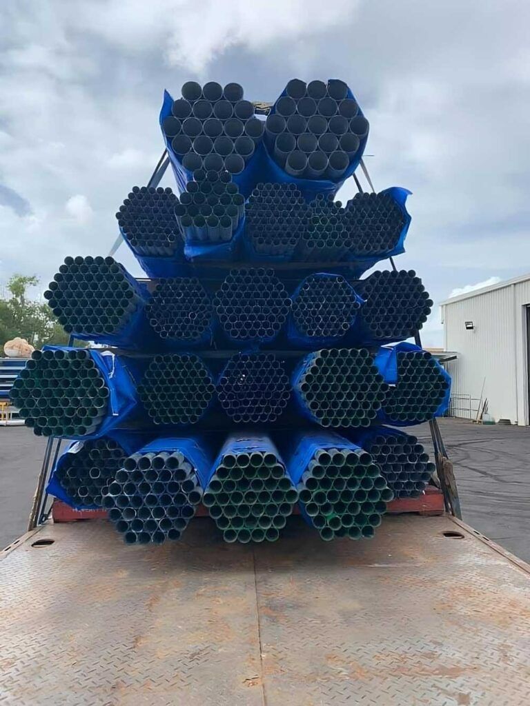 A Pile of Pipes Stacked on Top of Each Other on a Truck — Top End Steel Supplies Darwin In Alice Springs, NT
