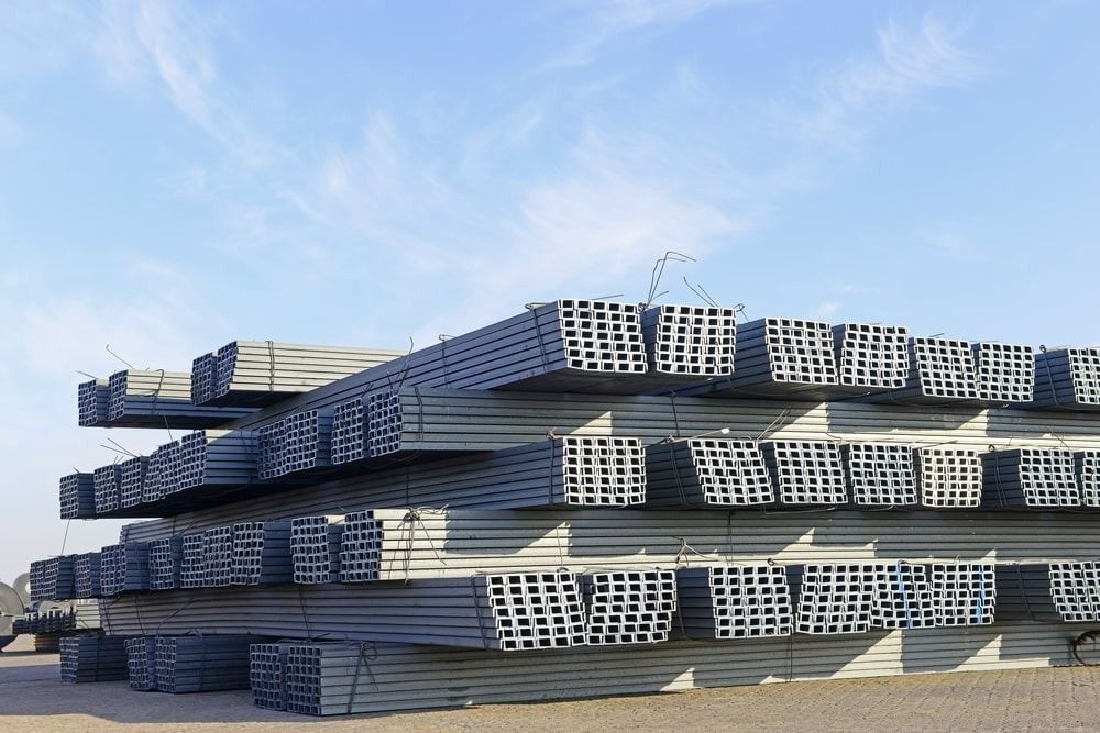 A Large Pile of Metal Scaffolding is Stacked on Top of Each Other — Top End Steel Supplies Darwin In Pinelands, NT