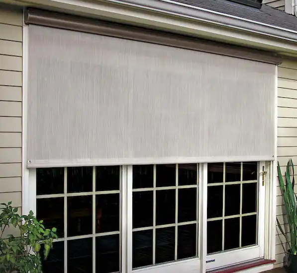 a close up of a window with a white blind on it .