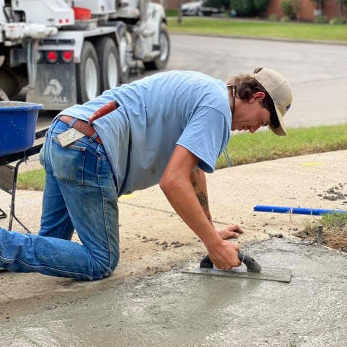 Man Installing New Walkway — Nashville, TN — Middle Tennessee Drainage Company
