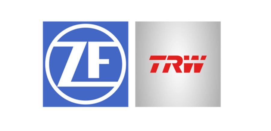 Loghi di ZF e TRW, ZF è blu, TRW è rosso su sfondo grigio.