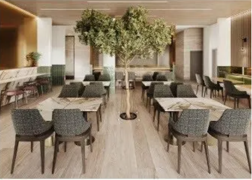 A restaurant with tables and chairs and a tree in the middle.