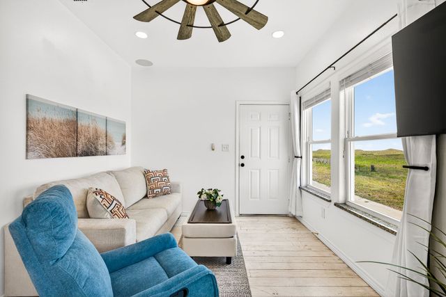 Port A Luxe II living room with coastal seating and natural light