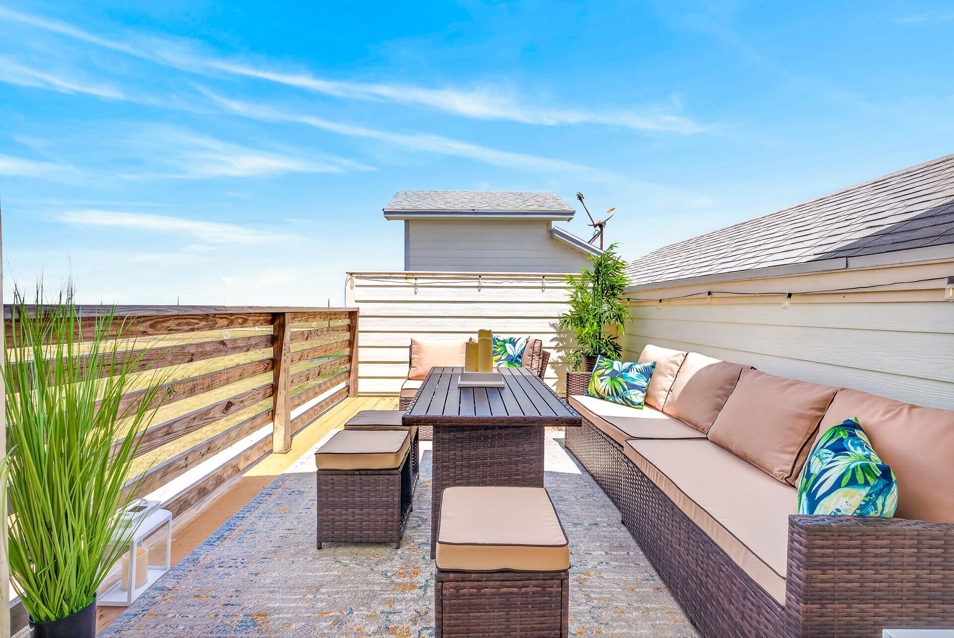 Private rooftop deck with lounge seating and open coastal views