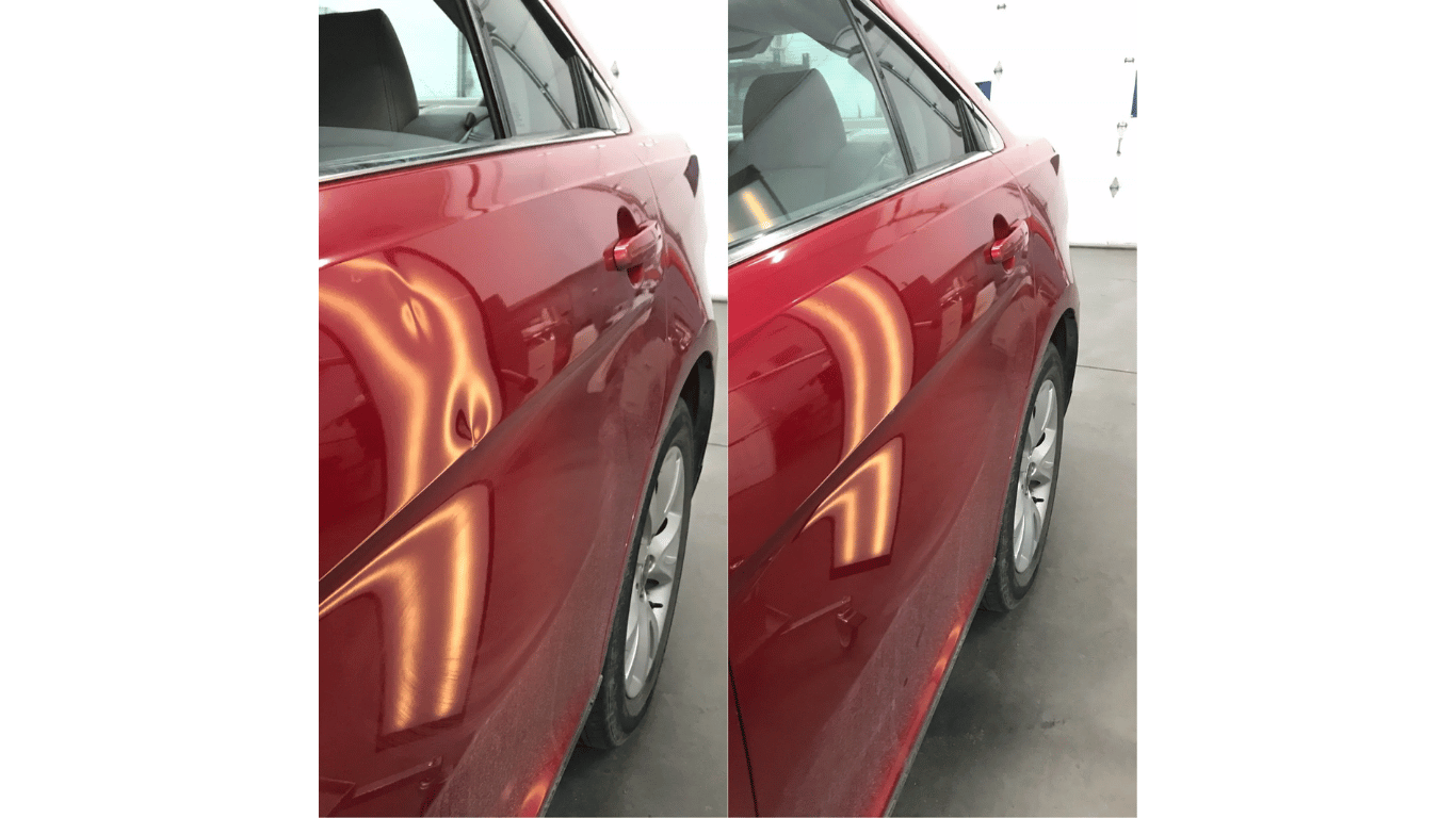 Red car side panel with noticeable reflection on the door and wheel visible on a concrete surface.
