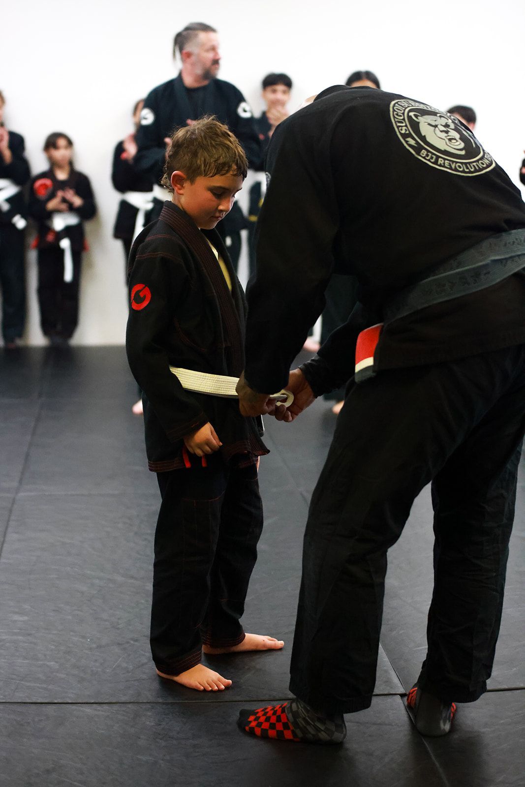 Kids practice partner drills at Sugoi Submission in Corpus Christi, TX, building confidence.