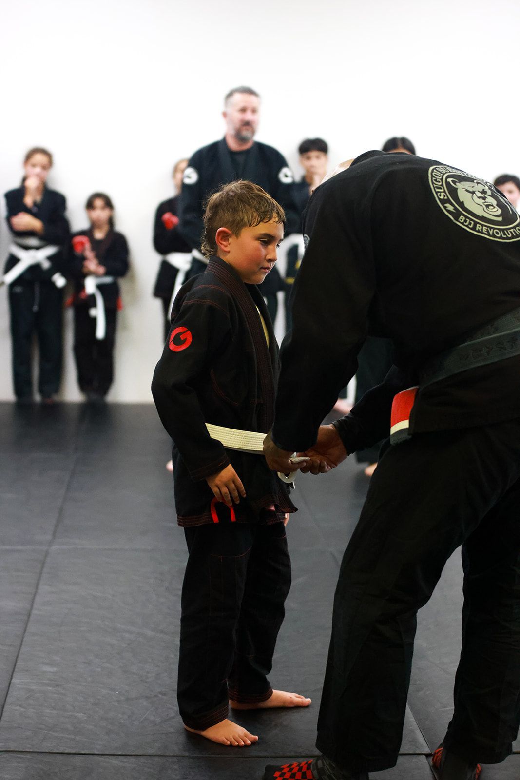 Kids practice safe grappling basics at Sugoi Submission in Corpus Christi, TX, building confidence.