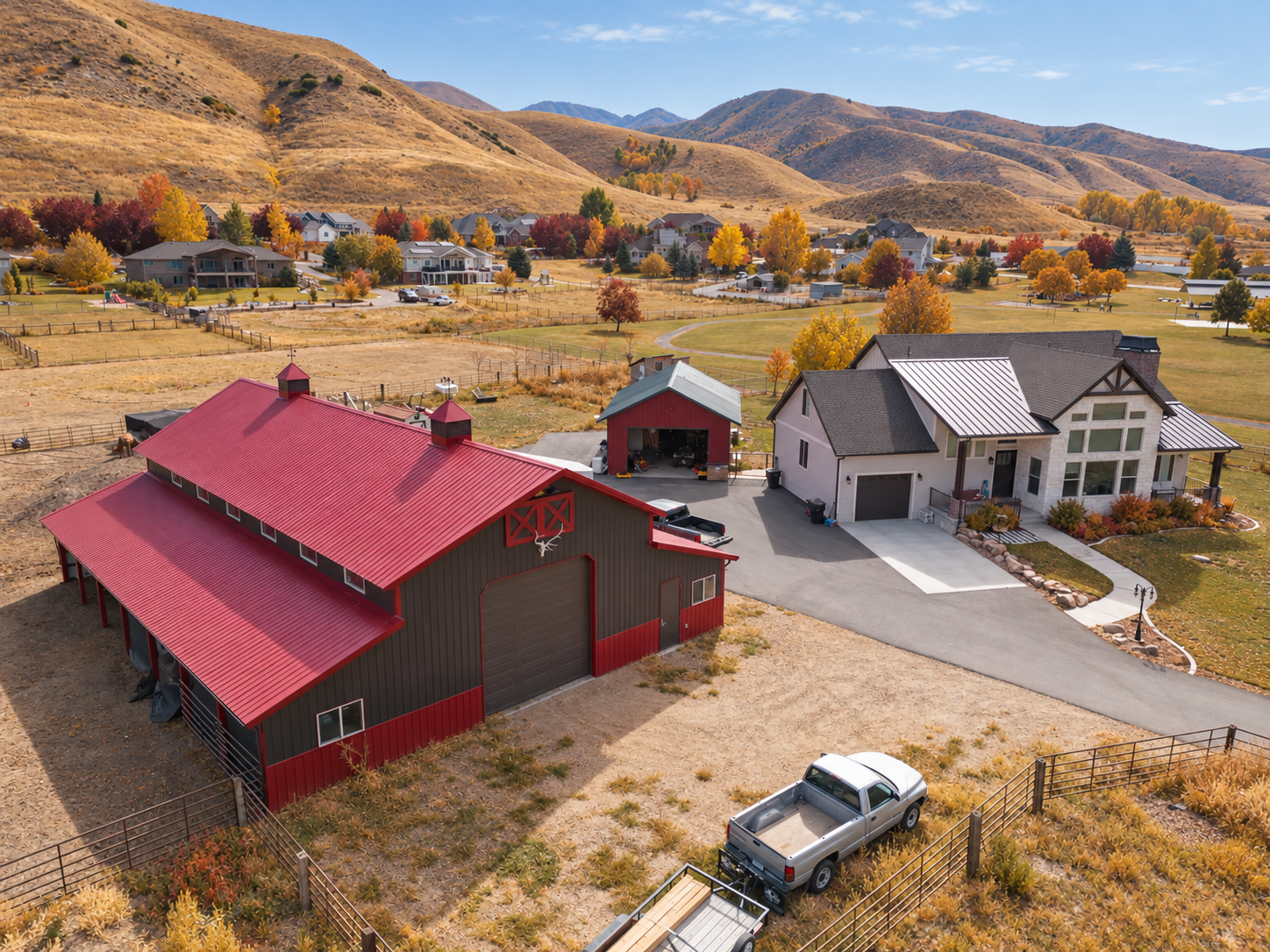 Finished steel garage beside golden aspens on a Colorado property in fall