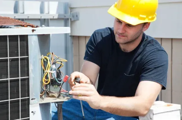 Professional technician from Aaron’s Services LLC providing HVAC Company Kansas City MO