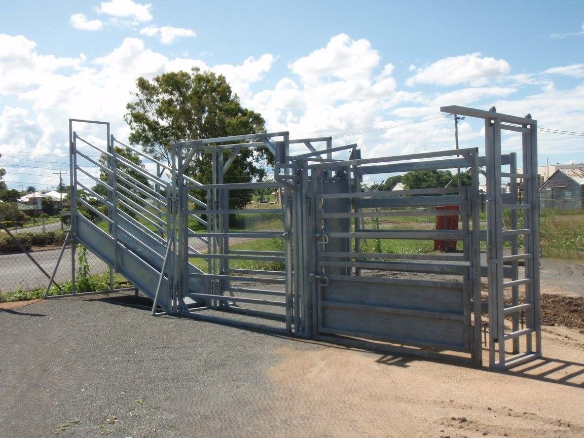 A metal fence with stairs leading up to it