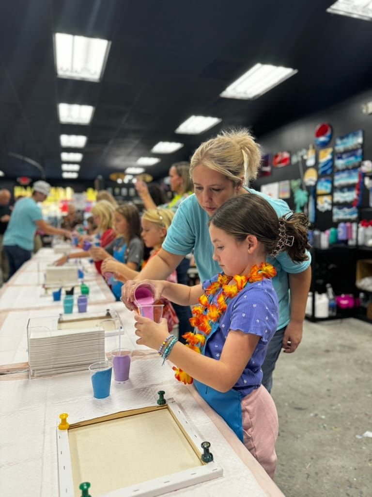 Children making bead art at a craft table in a bright store aisle