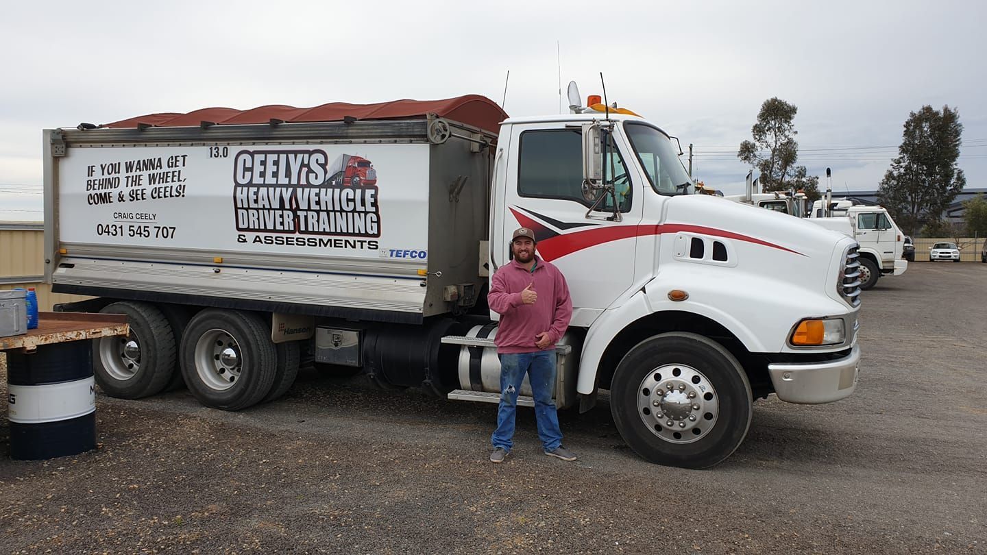 Bearded Man Giving a Thumbs Up by His Truck — Ceely's Heavy Vehicle Driver Training & Assessments In Griffith, NSW