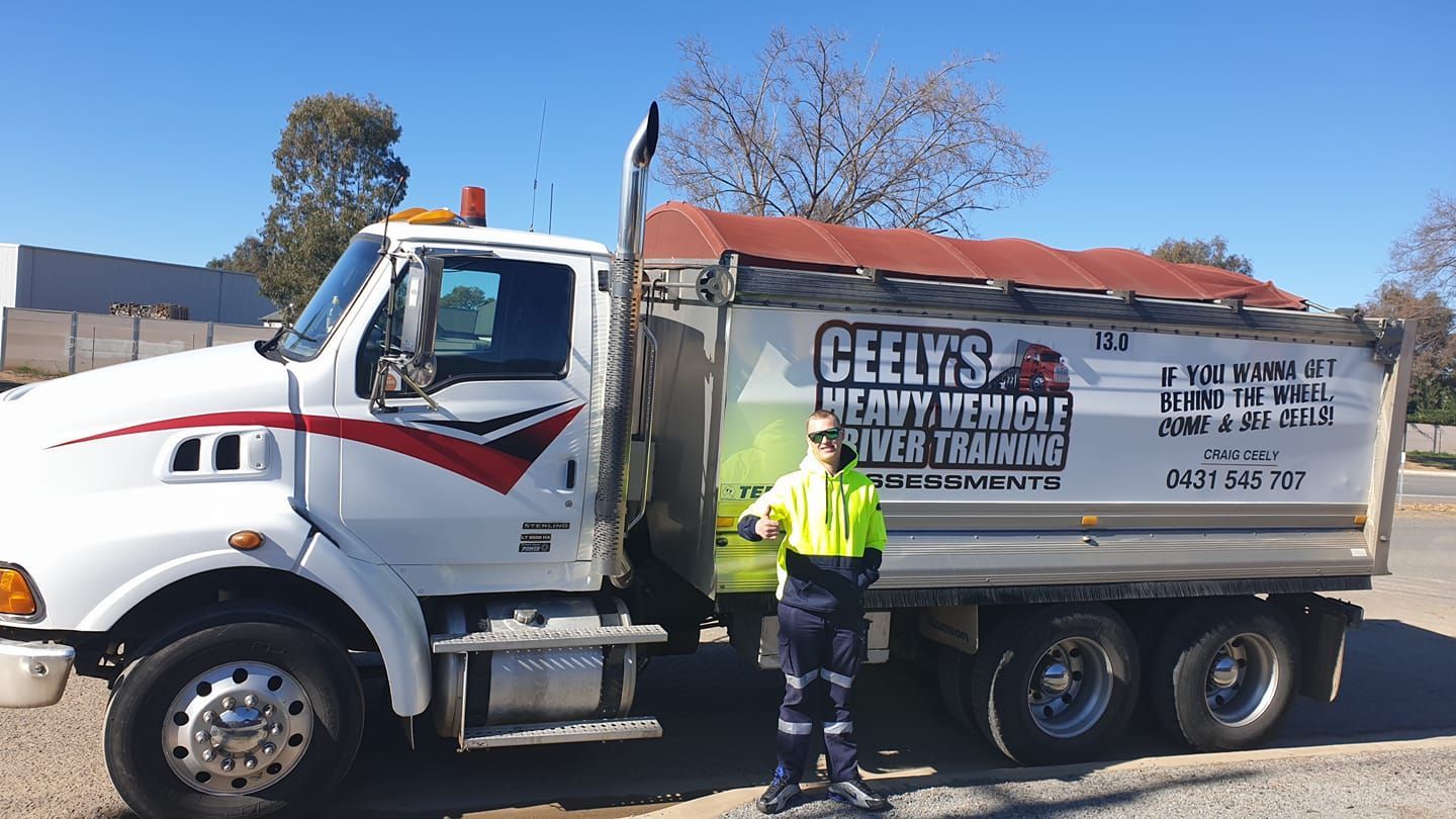 Man Smiling After Completing His Truck Driving Course — Ceely's Heavy Vehicle Driver Training & Assessments In Griffith, NSW