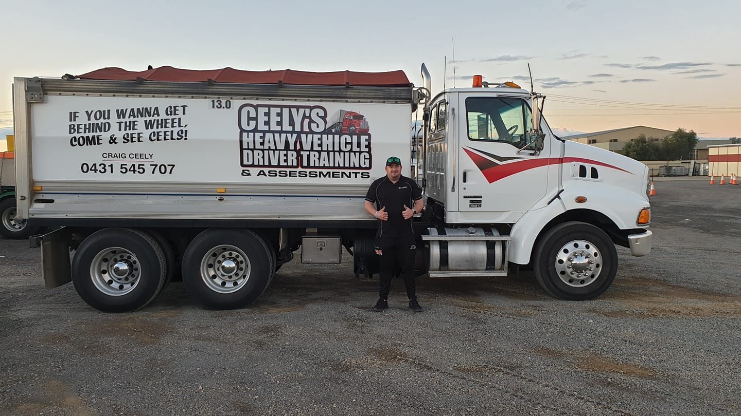 Proud Driver With His Truck — Ceely's Heavy Vehicle Driver Training & Assessments In Wagga Wagga, NSW 