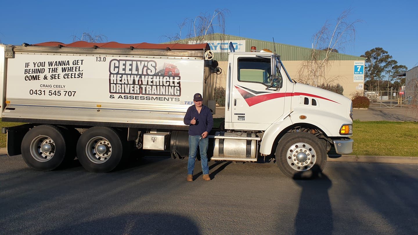 Man With a Cap Giving a Thumbs-up — Ceely's Heavy Vehicle Driver Training & Assessments In Albury, NSW  