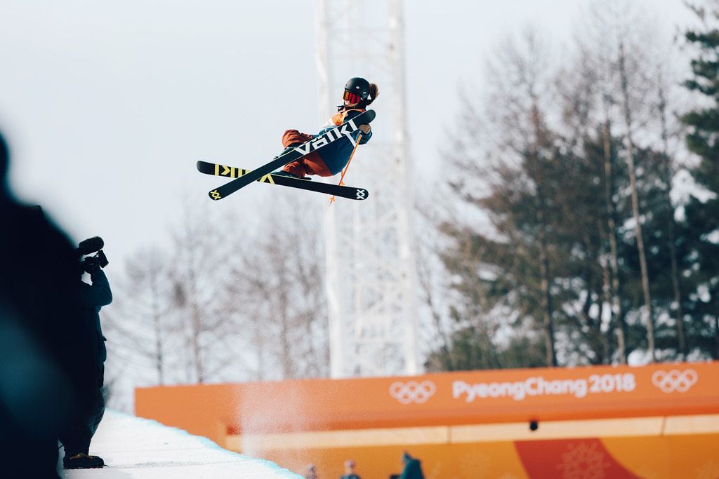 Skier midair during a freestyle jump at PyeongChang 2018 Olympics