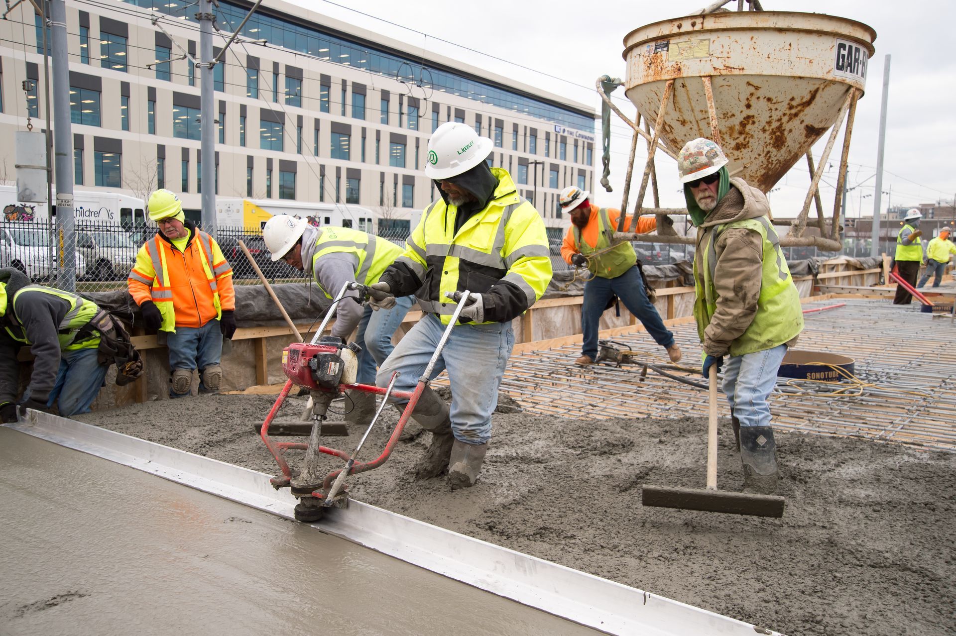 A group of construction workers are working on a construction site.
