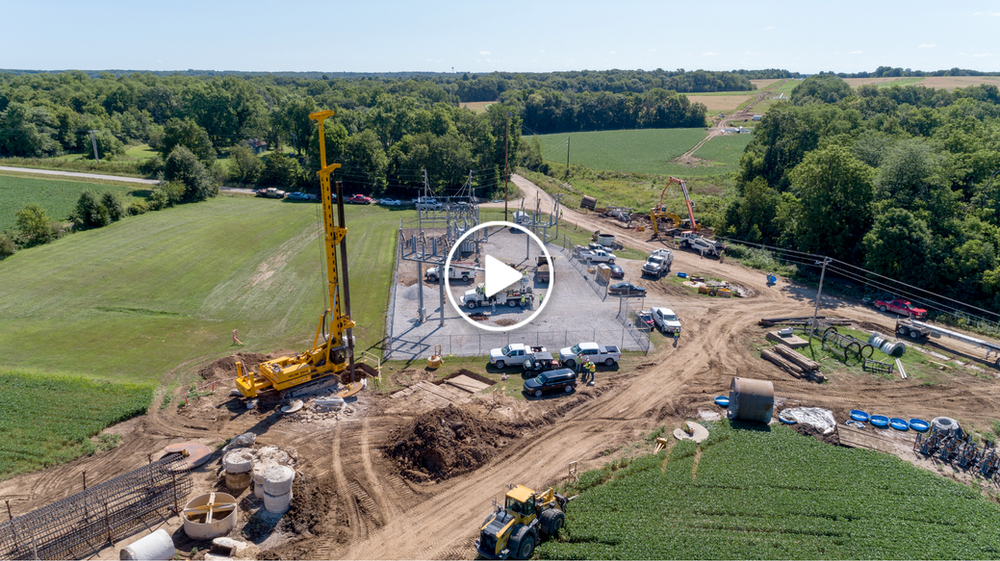An aerial view of a construction site in the middle of a field.