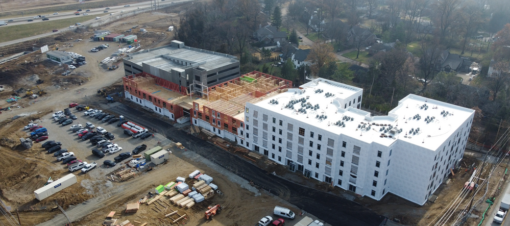 An aerial view of a large building under construction.