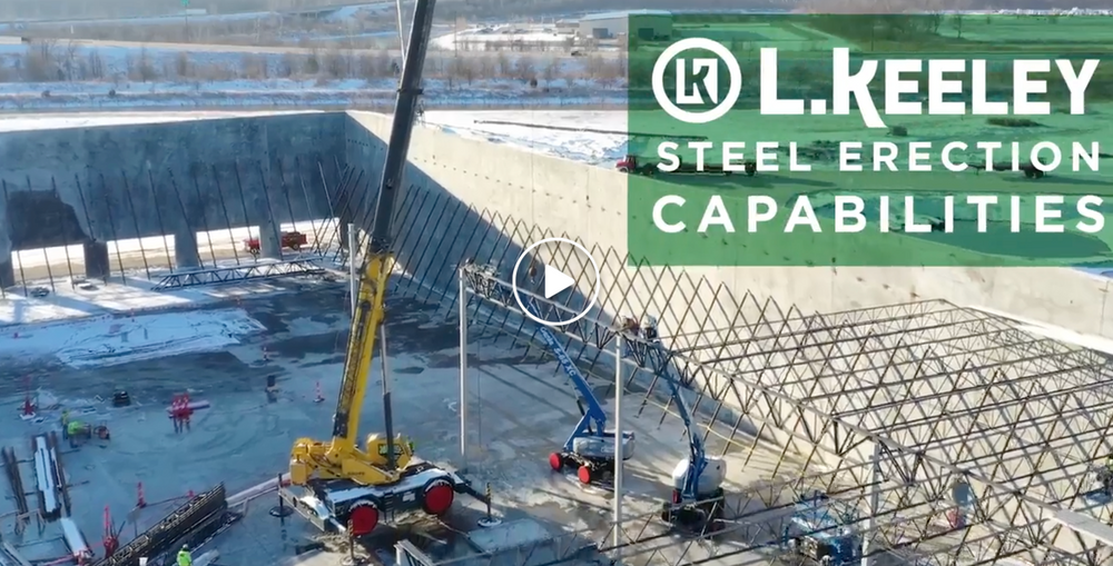 An aerial view of a construction site with a crane.