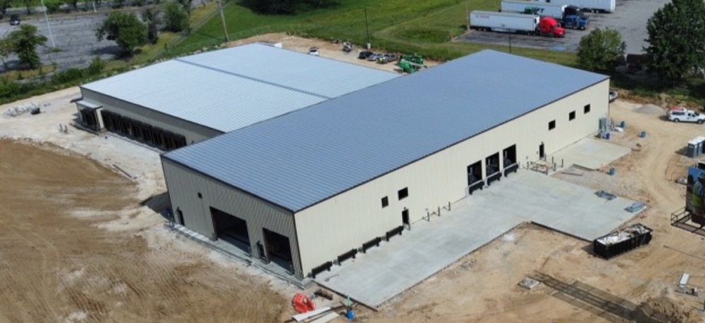 An aerial view of a large building under construction.