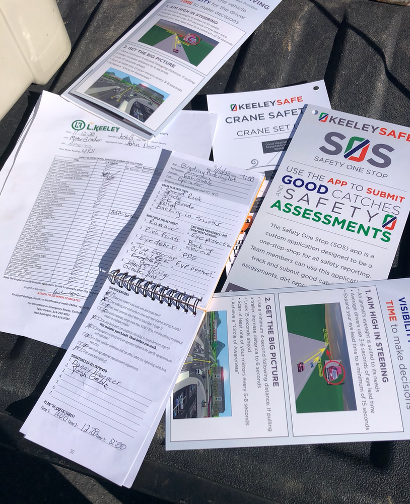 A bunch of papers on a table with one that says sos